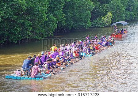 Chantaburi, Laem Sing, Thailand - 26 July 2019 Tourists Floating On Pvc Pipe Raft In The Lake Of Lae