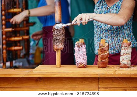 Trdelnik Is Street Food Of Prague. Three Types Of Trdelnik With Different Sprinkling Are Ready To Ea