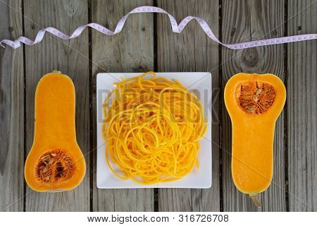 Top View Of Butternut Squash Noodles With Measuring Tape - Healthy Vegan Pasta