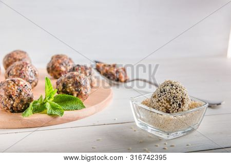 Vegetarian Food, Energy Balls Of Walnuts, Dates, Prunes, Cranberries, Honey With Sesame