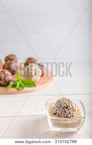 Vegetarian Food, Energy Balls Of Walnuts, Dates, Prunes, Cranberries, Honey With Sesame