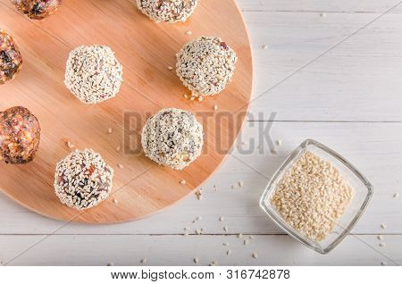 Vegetarian Food, Energy Balls Of Walnuts, Dates, Prunes, Cranberries, Honey With Sesame