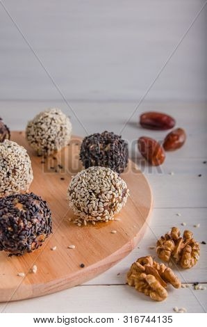 Vegetarian Food, Energy Balls Of Walnuts, Dates, Prunes, Cranberries, Honey With Sesame