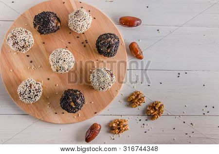Vegetarian Food, Energy Balls Of Walnuts, Dates, Prunes, Cranberries, Honey With Sesame