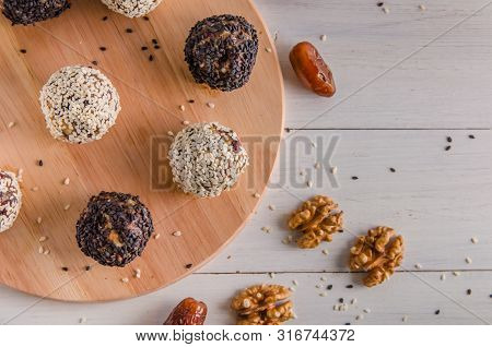 Vegetarian Food, Energy Balls Of Walnuts, Dates, Prunes, Cranberries, Honey With Sesame
