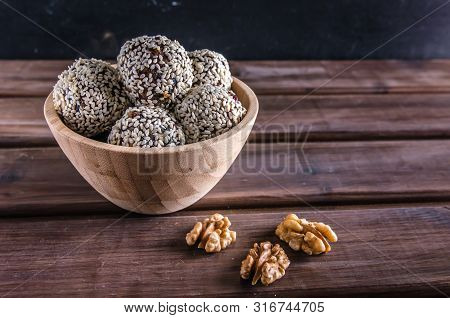 Vegetarian Food, Energy Balls Of Walnuts, Dates, Prunes, Cranberries, Honey With Sesame