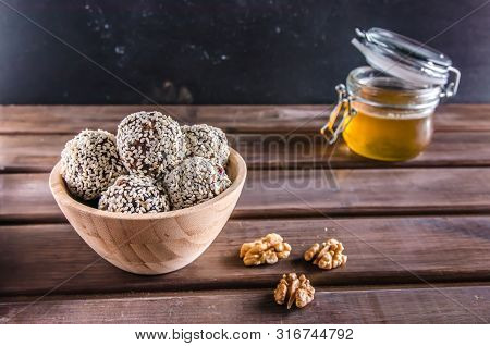 Vegetarian Food, Energy Balls Of Walnuts, Dates, Prunes, Cranberries, Honey With Sesame