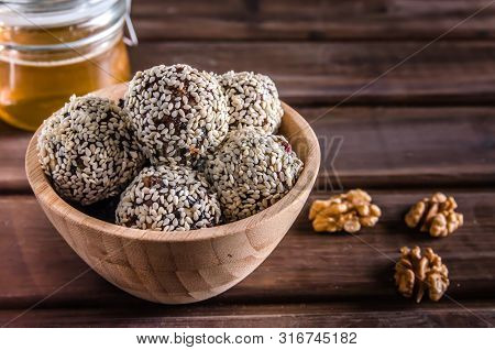 Vegetarian Food, Energy Balls Of Walnuts, Dates, Prunes, Cranberries, Honey With Sesame
