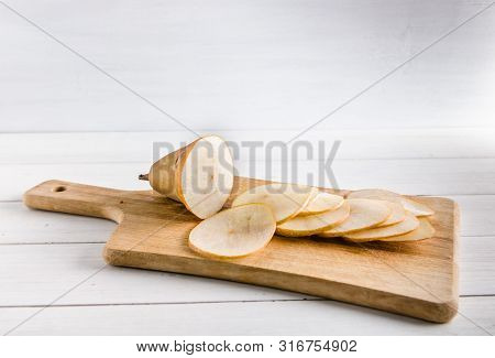 Sliced Pear For Making Chips On White Background