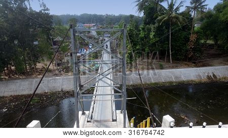 A Suspension Bridge Crosses The River. Supporting Inter-regional Transportation Facilities. Traffic 