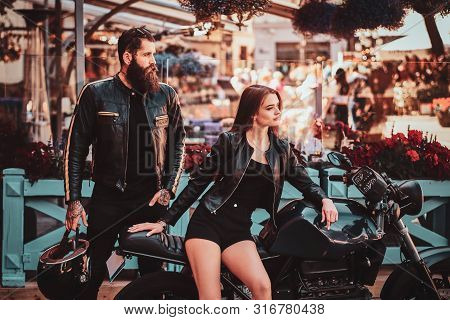 Beautiful Couple With Brutal Biker And His Sexy Gilfriend Are Chilling Near Cefeteria With Motorbike