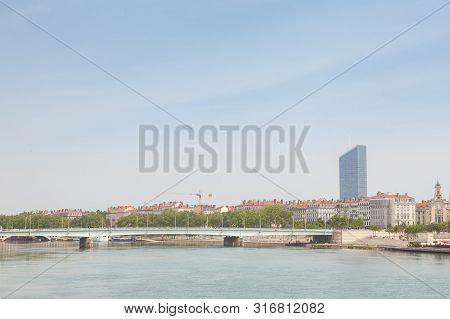 Pont De La Guillotiere Bridge In Lyon, France Over A Panorama Of The Riverbank Of The Rhone River (q