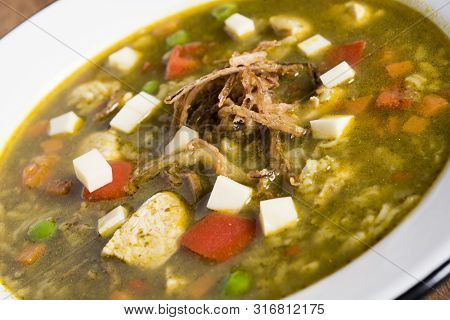 Peruvian Cilantro Chicken Soup Or Aguadito De Pollo With Yukon Gold Potatoes Corn On The Cob And Lim