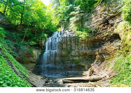 Tiffany Falls In Hamilton, Ontario During The Summer Time Beautiful Green Leaves