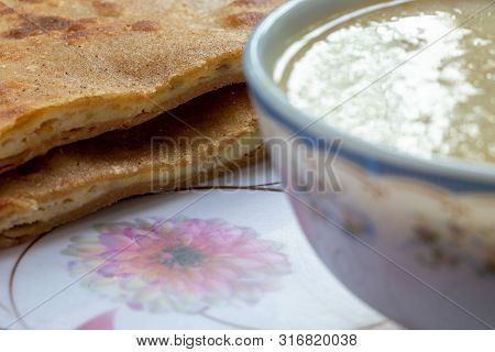 Egg Paratha With Dalia Or Daliya, Cereal Food Know As Bulgur Cooked In Milk Served With Egg Stuffed 