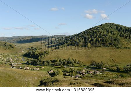 Taiga Village Generalka In The Mountains Of Altai Krai. Western Siberia. Russia