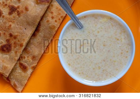 Egg Paratha With Dalia Or Daliya, Cereal Food Know As Bulgur Cooked In Milk Served With Egg Stuffed 
