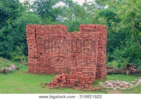 Inidan Red Clay Bricks Piles In Stacks.