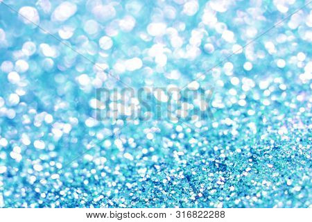 Blue Bokeh Texture. Festive Glitter Background With Defocused Lights