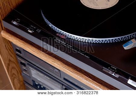Technics Turntable in the tower rack of audio stereo components