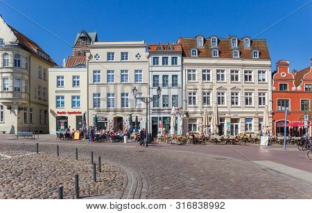 Wismar, Germany - April 19, 2019: Cafes And Restaurants At The Market Square Of Wismar, Germany