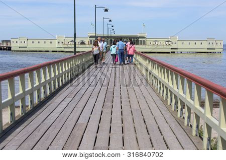 Malmo, Sweden - June 24, 2019: Ribersborgs Open-air Bath, Wooden Pier In The Baltic Sea With Walking