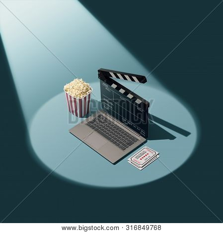 Online Movie Streaming And Cinema: Laptop With Clapperboard As Screen, Popcorn And Tickets In The Sp