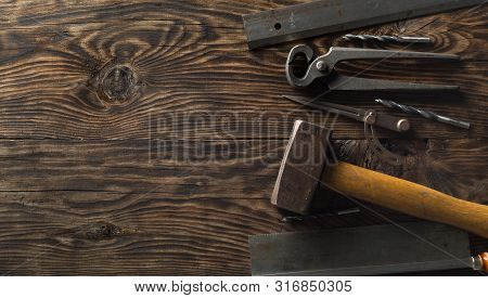 Collection Of Old, Used Wood Working Tools Flat Lay From Above On Dark Moody Wooden Background With 