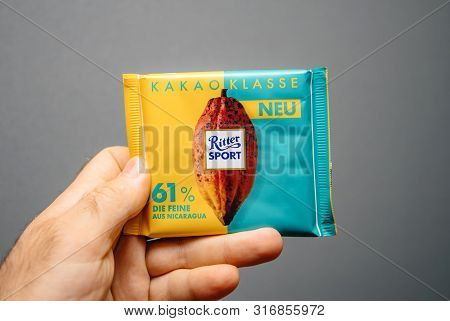 Paris, France - Apr 27, 2019: Man Hand Holding Delicious Ritter Sport Cacao Classe With 61 Percent C