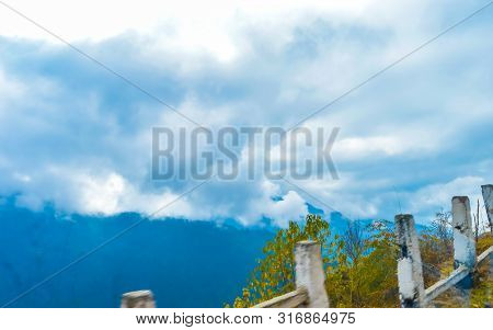 Vibrant Storm Clouds Background With Tiny Clouds Floating In The Sky In Sunset Time. Natural Sky Com