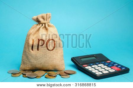 Money Bag With The Word Ipo (initial Public Offering; Stock Market Launch) And A Calculator. The Fir