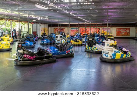 Gothenburg, Sweden - July 18, 2019: Random Parked Empty Colorful Bumper Cars At An Amusement Park Wi