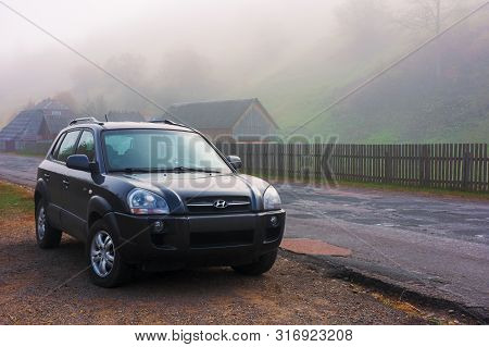 Mizhhirya, Ukraine - Oct 14, 2018: Hyundai Tucson Suv On The Old Cracked Countryside Road Side In Vi