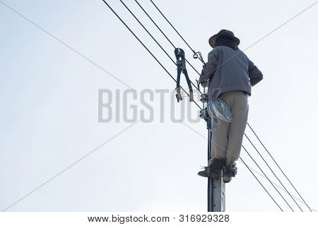 Electricty Power Lines Man Climbing.