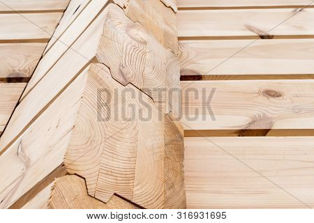 Wood Glued Timber Close Up Background. Wooden Construction Glued Laminated Timber In The Wall Of The