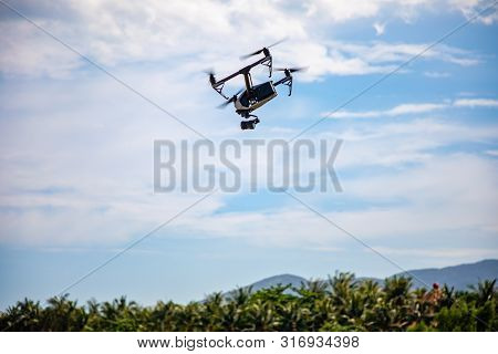 Sanya, Hainan Island, China - 22.06.2019: Dji Inspire - Drone Uav Quadcopter Which Shoots 4k Video A