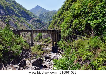 North Korea. Local Road Between Rocks In Ulim Mountains