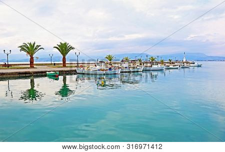 Landscape Of Nafplio Harbor With Fishing Boats Reflected On Water - Argolis Greece