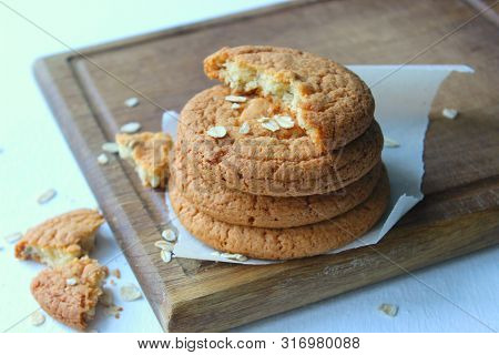 Homemade Oatmeal Cookies On An Old Wooden Table, Rustic Style. Oatmeal And Cinnamon Sticks. Copy Spa