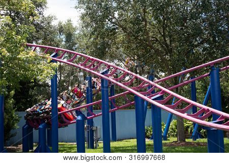 Orlando, Florida. August 07, 2019. People Enjoying Super Grovers Box Car Derby. It Is A Family Frien