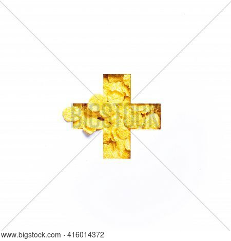 Plus Summation Sign Or Cross Of Corn Flakes Isolated On White. Typeface. Healthy Eating And Calories