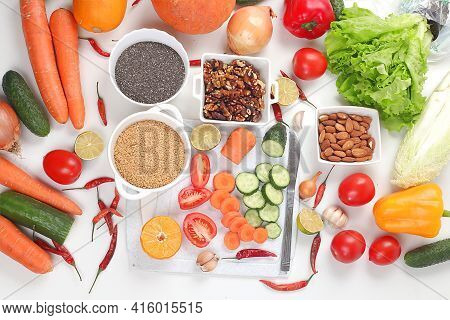 Vegetables, Fruits, Nuts, Seeds On A Light Background. The Concept Of Healthy And Natural Food For W