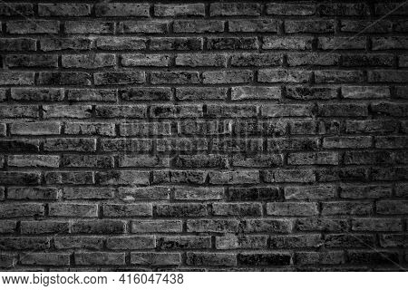 black brick wall background. dark stone texture.