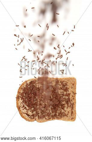 Typical Dutch Chocolate Sprinkles Falling (hagelslag), Used On Bread, Cake Or Desserts