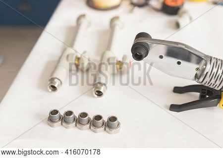 Soldering Iron For Polypropylene With Polypropylene Pipe With Tap On White Table
