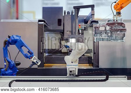 Industrial Robotic Gripping And Robotic 3d Scan Working On Teamwork With Engine Parts Of Motorbike I