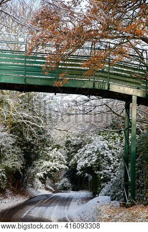 A Country Lane In The Snow On A Sunny Day