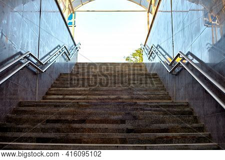 Modern Underground Passage. Steps And Handrails In The Foreground. Empty Underpass. Stone Stairs Go 