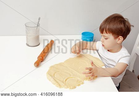 Little Boy Helps Mother To Cook  Making Homemade Coockies. Casual Lifestyle In Home Interior, Pretty