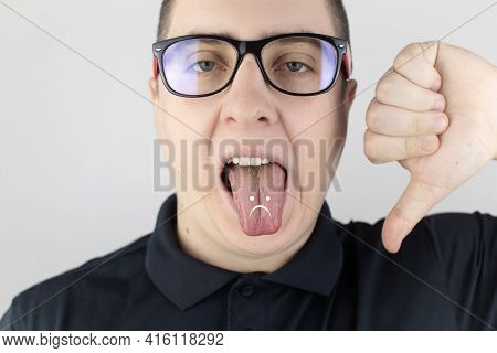 A Man With Bad Breath Looks At The Camera. Fetid Odor Concept. Close-up Of A Person Who Hears A Sten